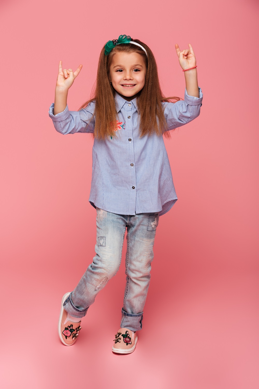 /storage/photos/1/Products/full-length-picture-funny-little-girl-gesturing-rock-sign-with-two-hands.jpg